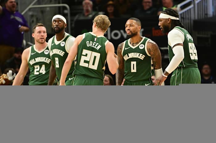 Milwaukee Bucks guard Damian Lillard (0) stands with teammates